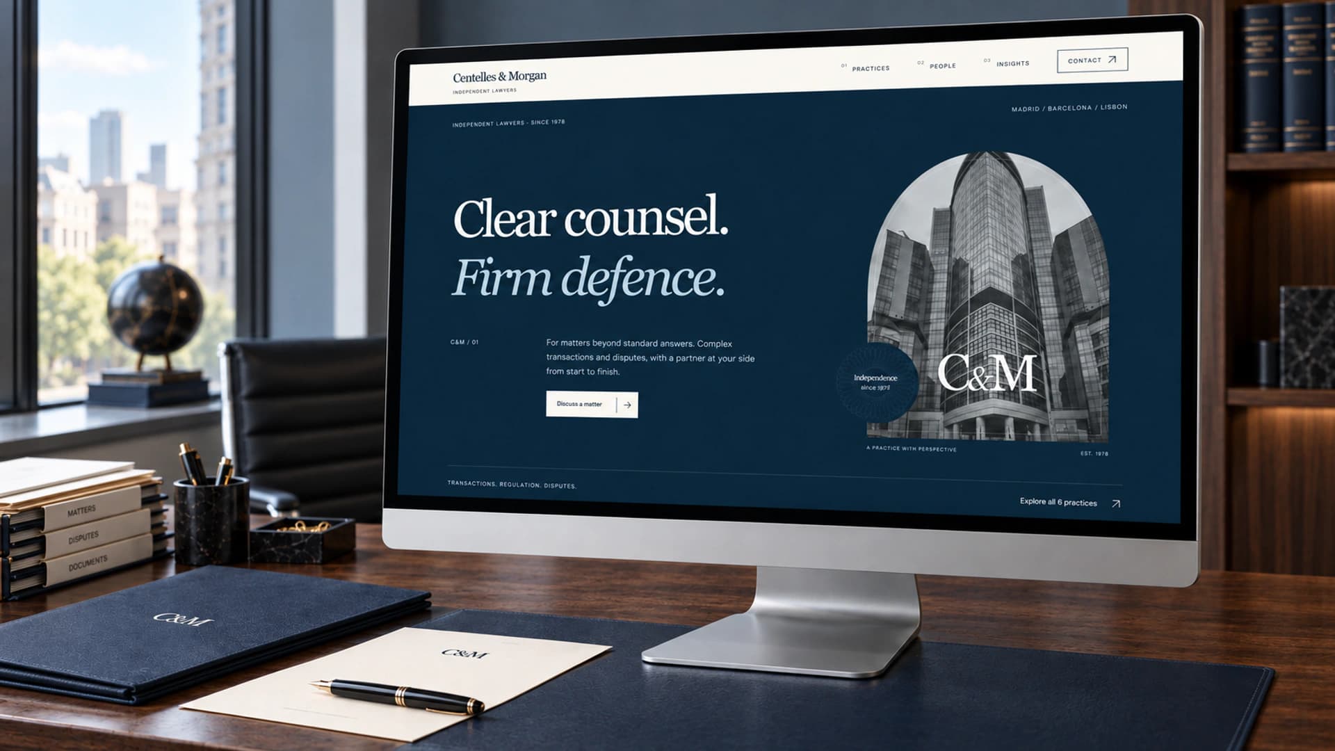 Illustrative mockup of the redesigned Centelles & Morgan homepage on a monitor in a walnut legal office, with navy case files and ivory stationery.